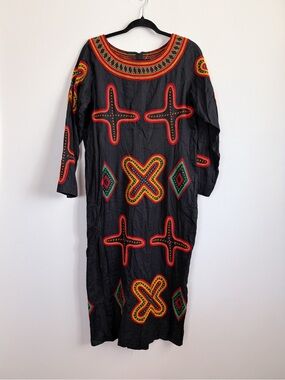 black traditional Cameroonian Toghu (or Atoghu) dress with vibrant embroidery